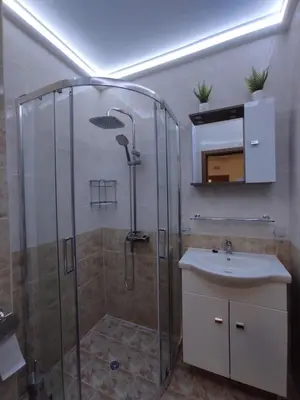 a bathroom with a shower and a sink at Chocolate Apartment on Sunny Day 6 Complex in Tŭnkovo
