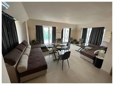 a living room with a couch and a table at Top floor luxury apartment in Sunny Beach in Sunny Beach