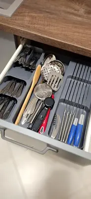 a drawer filled with cooking utensils on a shelf at Byala Vista A-54 in Byala