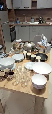 a table with plates and dishes on it in a kitchen at Byala Vista A-54 in Byala