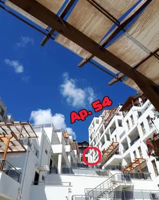 a view of some white buildings with a red acsa sign at Byala Vista A-54 in Byala