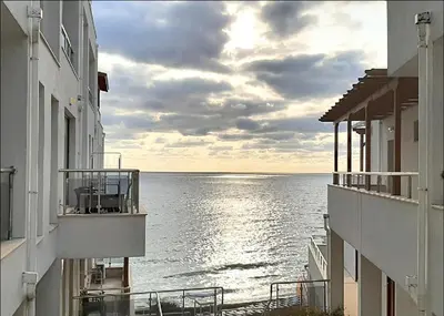 a view of the ocean from between two buildings at Byala Vista A-54 in Byala