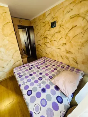 a bed with a polka dot mattress in a room at Guest House Amfora with a sea view in Sozopol