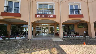 a facade of a building with a red evacuation sign at Boho Breeze Aheloy in Aheloy