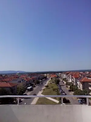 a view of a street in a city with buildings at Apartment Terrace under the stars in Primorsko