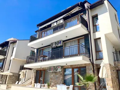 an apartment building with balconies on top of it at Apartments in Villas Apolon in Sozopol
