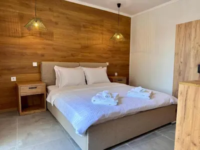 a bedroom with a bed with two towels on it at Casa Adora in Sozopol