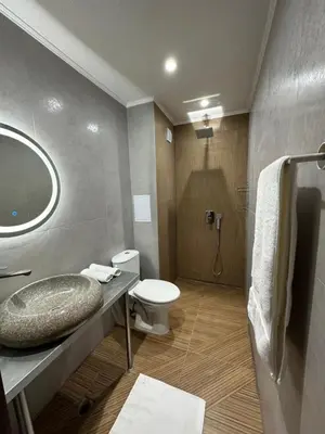 a bathroom with a sink and a toilet at Casa Adora in Sozopol