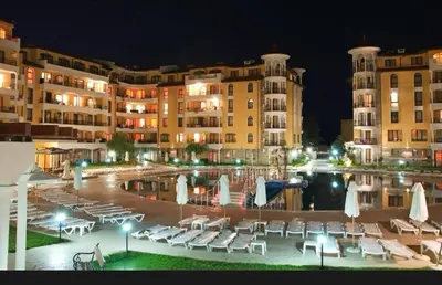 a resort with a pool and some chairs and buildings at 2 Room Apartment Royal Sun Sunnybeach in Sunny Beach