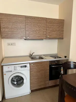 a kitchen with a washing machine and a sink at 2 Room Apartment Royal Sun Sunnybeach in Sunny Beach