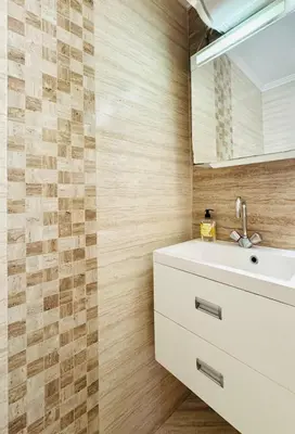 a bathroom with a sink and a mirror at Park suite in Burgas City