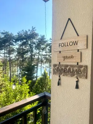 a sign on the side of a building that reads follow at Marena Studio - Santa Marina, Sozopol in Sozopol