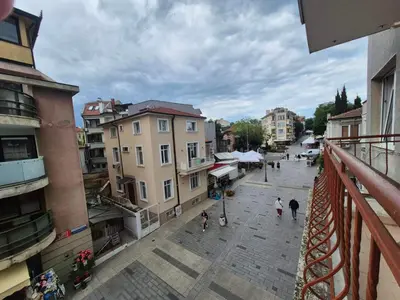 a city street with people walking down the street at 2 Rooms Apartment - Top Center of Burgas in Burgas City