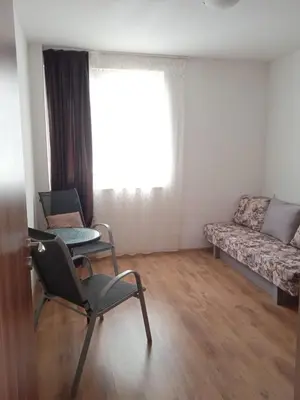 a living room with two chairs and a couch at Тристаен апартамент в Бяла комплекс Атлантик in Byala