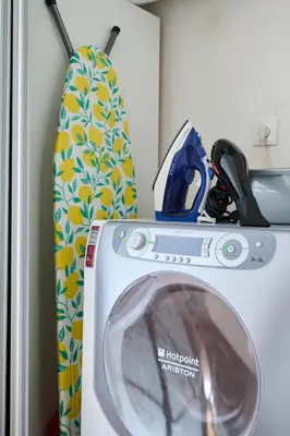 a washing machine with a pair of scissors on top of it at Sirena Seaview Apartment - FREE PARKING in Varna City