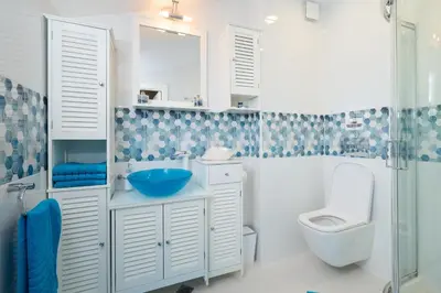 a bathroom with a sink and a toilet and a shower at Sirena Seaview Apartment - FREE PARKING in Varna City
