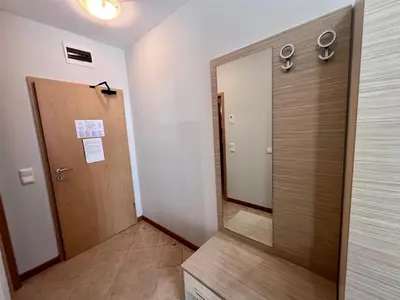 a hallway with a door and a mirror at Apartament Royal Sun Romantic - 5 min to the beach in Sunny Beach