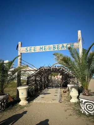 a wooden bridge with a sign that reads seaweed beach at 2 Zimmerwohnung in Shkorpilovtsi