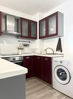 a kitchen with a sink and a washing machine at Apartment 7 in Sozopol