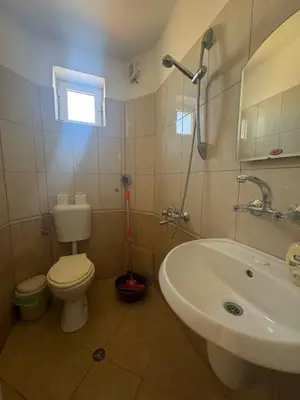 a bathroom with a toilet and a sink at Anastra in Pomorie