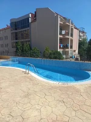 an empty swimming pool in a building at Cozy studio 150m from the beach in Sveti Vlas