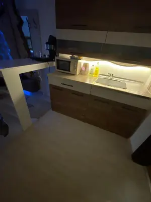 a kitchen with a sink and a microwave at Sea view apartment in Sozopol