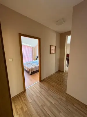 an empty room with a bed and a mirror at VP Pacific 2 in Sunny Beach