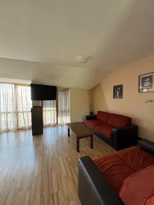 a living room with a couch and a table at VP Pacific 2 in Sunny Beach