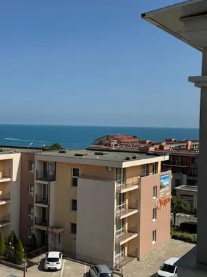 a view of a building with the ocean in the background at VP Morski Briag in Sveti Vlas