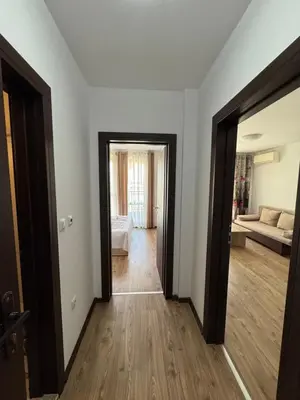 a room with an open door to a living room at VP Morski Briag in Sveti Vlas