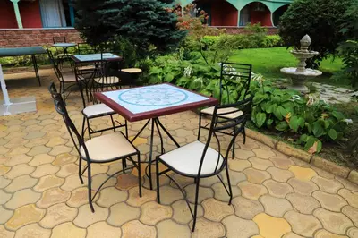 a group of tables and chairs on a patio at Jasmine - Menada Apartments in Sunny Beach