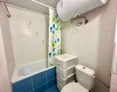 a bathroom with a toilet and a bath tub at Jasmine - Menada Apartments in Sunny Beach