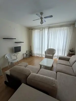 a living room with a couch and a table at PSB Apartment in Flores park in Sunny Beach