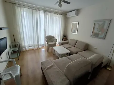 a living room with a couch and a table at PSB Apartment in Flores park in Sunny Beach