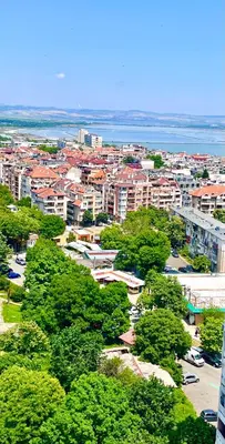 an aerial view of a city with trees and buildings at PanoramaView Lazur in Burgas City