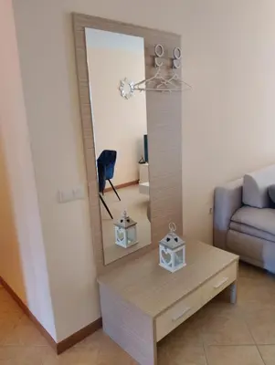a mirror on a table in a living room at 2 Room Apartment with Poolview Royal Sun in Sunny Beach