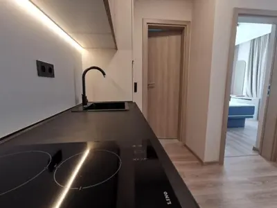 a kitchen with a black counter top and a sink at Sorrento Sole Mare Sveti Vlas in Sveti Vlas