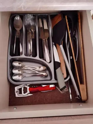 a drawer filled with silver utensils in a drawer at Family Studio flat in Tŭnkovo