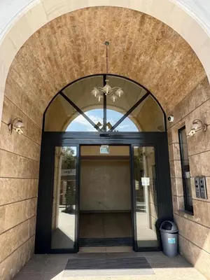 an entrance to a building with a glass door at Villa ROMA apartaments&SPA in Nesebar