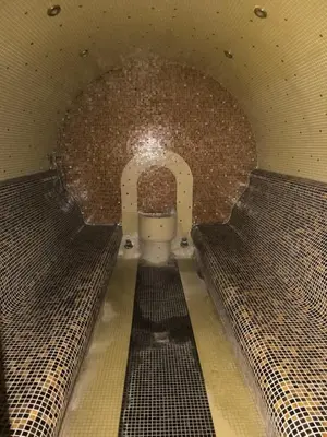 a tunnel with a toilet in a brick wall at Villa ROMA apartaments&SPA in Nesebar