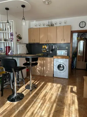 a kitchen with a counter and a washing machine at Passat12 in Sunny Beach