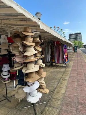 a display of hats for sale at a market at Passat12 in Sunny Beach