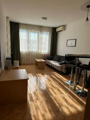a living room with a couch and a table at Passat12 in Sunny Beach