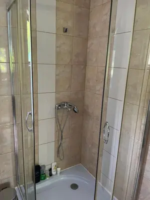 a bathroom with a shower and a bath tub at The Byala Escape, Private Villa with Bar & Hot Tub in Byala