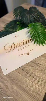 a sign for a dining table with a palm tree at Divine place Pomorie in Pomorie