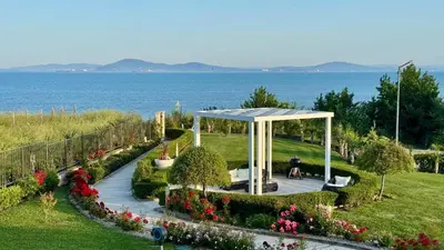 a gazebo in a park next to the water at Апартамент Панорама, двустаен, малък, първа линия, гледка море, DIAMOND BEACH, Сарафово in Burgas City