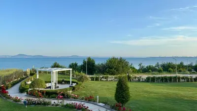 a garden with a gazebo in a park at Апартамент Панорама, двустаен, малък, първа линия, гледка море, DIAMOND BEACH, Сарафово in Burgas City