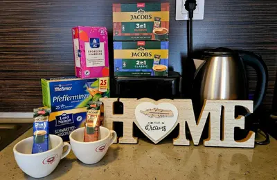 a sign that says me next to cups of coffee at Апартамент Комфорт in Varna City