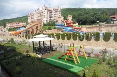 a park with a playground with a slide and slides at Квартира студия Villa Astoria 2 Болгария Солнечный берег in Elenite