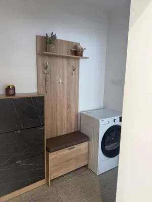 a laundry room with a washer and a washing machine at Lazzuro 7 in Burgas City